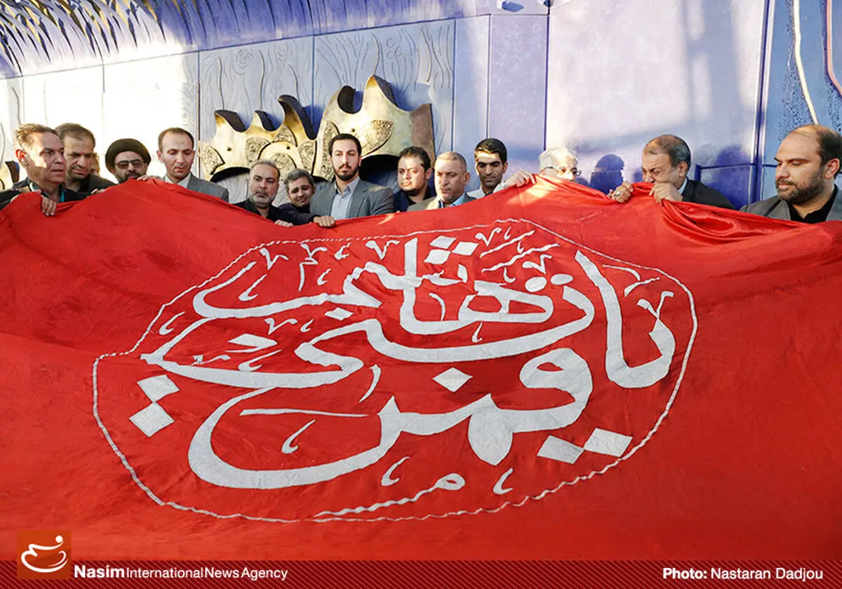 گزارش تصویری:: اهتزاز پرچم حرم حضرت ابوالفضل‌(ع) در برج میلاد