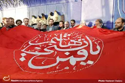 گزارش تصویری:: اهتزاز پرچم حرم حضرت ابوالفضل‌(ع) در برج میلاد
